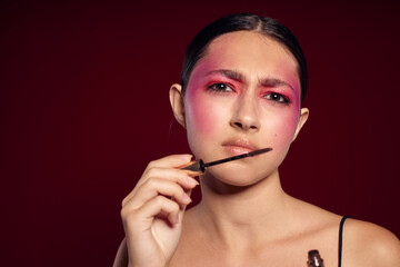 Obraz premium Beauty fashion female bright makeup posing fashion emotions cosmetics cropped view unaltered