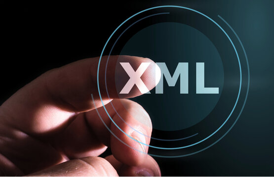 Hand pressing XML button on virtual screens. Extensible Markup Language
