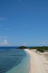 Fototapeta na wymiar Beautiful scenery of One Dollar Beach located between Dili and Manatuto, Timor Leste. White sandy beach landscape.