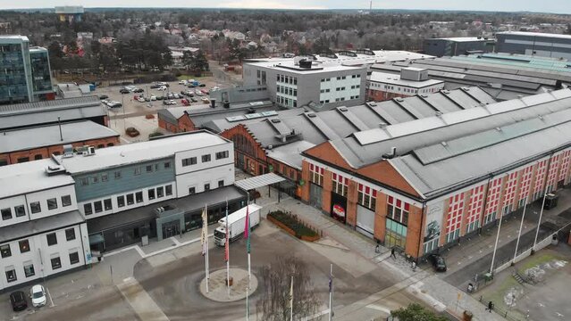 Aerial flying towards Saab Car Museum and Innovatum Science Center buildings in Trollhattan, Sweden