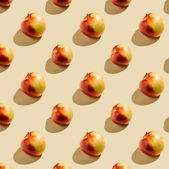 Pattern of apples on a beige background.