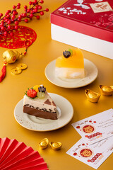 Homemade Fruit Pudding with strawberry, grape, orange, longan, kiwi and peach ingredients decorated with chinese new year ornament.