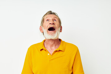Portrait of happy senior man with a gray beard emotion gestures hands monochrome shot