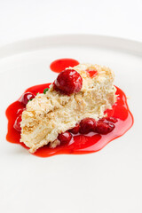 napoleon cake with cherry sauce and mint