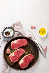 Grilled fish, seafood and meat assortment on light background.