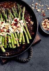 Warm salad with asparagus, cheese, nuts