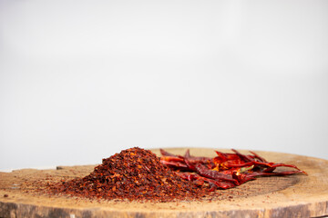 pieces of dried red pepper on wooden table