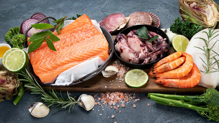 Fresh seafood arrangement on dark background.