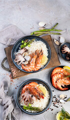 Shrimps with rice on light gray background.