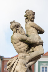 Obraz premium Proserpina fountain in front of the the historical town hall to Poznan, Poland, ancient statue in the old town. Landmarks in the city. Details.