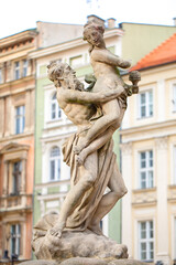 Fototapeta premium Proserpina fountain in front of the the historical town hall to Poznan, Poland, ancient statue in the old town. Landmarks in the city. Details.