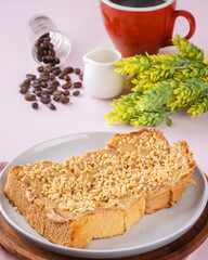 roti bakar is usually prepared as a sandwich of grilled white bread with a filling, consumed both as a light breakfast and a common street food. 