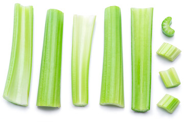 Pile of celery ribs isolated on white background.