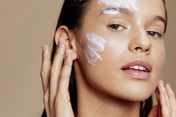 beautiful woman face mask cream clean skin facial scrub close-up make-up