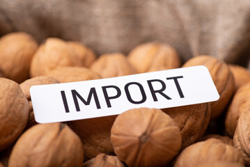 Paper with inscription Import on walnuts. Trade between countries of walnuts