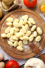 Concept of cooking with raw potato gnocchi, top view