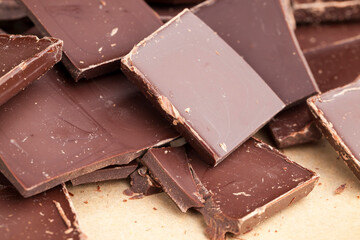 a chocolate bar broken into more pieces