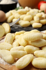 Concept of cooking with raw potato gnocchi, close up