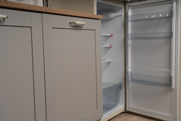 old fridge with open door in the Kitchen