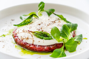 beef tartar on the white plate
