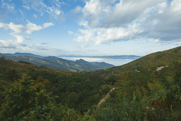 Beautiful blue sky high peak mountains mist fog wildlife green forest at changrai