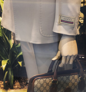 display of clothes and accessories of the prestigious Italian fashion house Gucci on mannequin