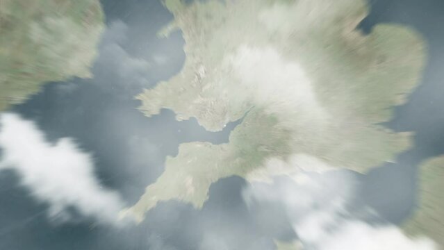 Earth zoom in from outer space to city. Zooming on United Kingdom, Cardiff. The animation continues by zoom out through clouds and atmosphere into space. View of the Earth at night. Images from NASA