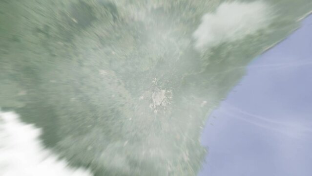 Earth zoom in from outer space to city. Zooming on Almiranti Tamandare, Brazil. The animation continues by zoom out through clouds and atmosphere into space. Images from NASA