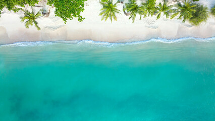 The tropical  summer white sand beach with a water wave background -Summer season image - obrazy, fototapety, plakaty