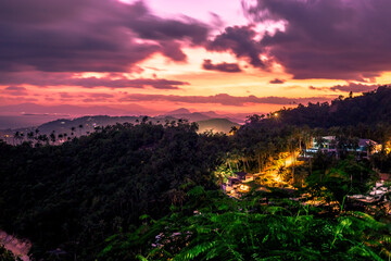 Background of mountains and nature surrounded, bright blue sky wallpaper. There are trees, green leaves, a beautiful ecology.