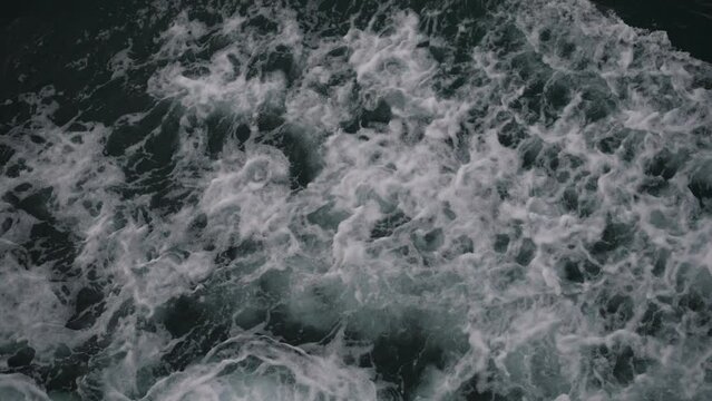 traces of a sailing boat on the water
