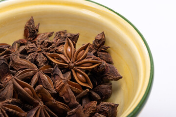 Star anise in a vintage ceramic bowl