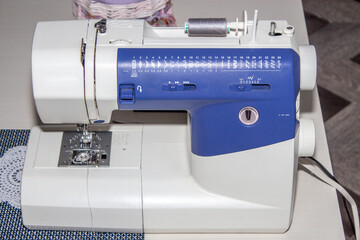 Overlock sewing machine. Making clothes, sewing. 
