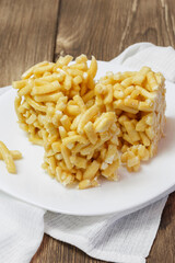 Chak-chak pastry, sweet dessert on a plate on the table. National dish, traditional cuisine, oriental sweetness