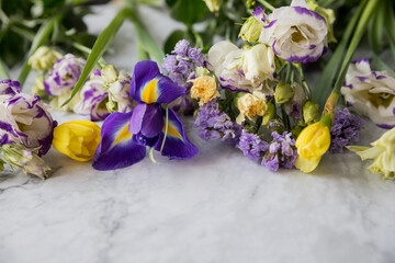 Beautiful bouquet of flowers: iris, mimosa, tulip, , lisianthus. Happy easter, happy mothers day concept. Copy space. advertisement, invitation, announcement for designers.
