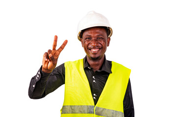 young man construction engineer riding the victory sign smiling.