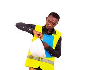 young man inspector architect holds safety helmet and clipboard.