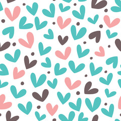 Seamless background with cute hearts in pastel colors.