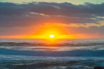 Fototapeta premium Soft sunrise seascape with clouds