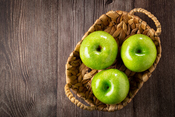 Green apples on the table.