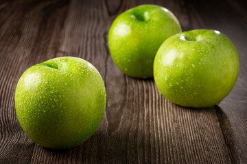 Green apples on the table.