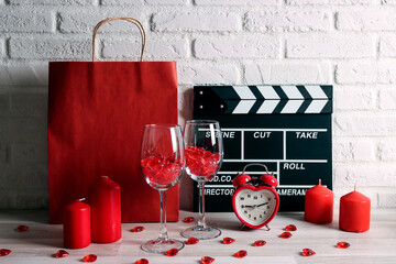 Romantic dinner home set. Candles, wine glasses, gifts and movies.