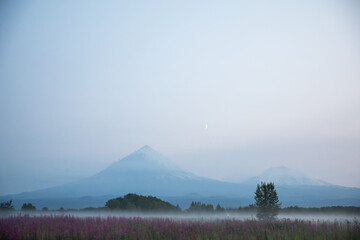 The active Kamchatka Volcano Klyuchevskaya Sopka at dawn