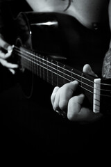 Fototapeta premium Man playing guitar and singing shirtless