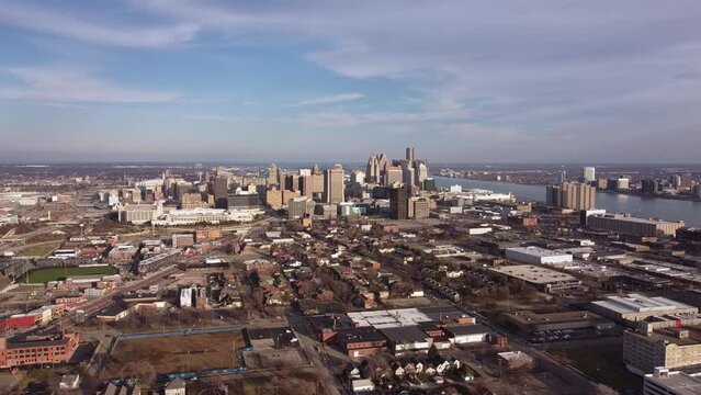 Ariel Pan arount Downtown Detroit Michigan on a partly cloudy day
