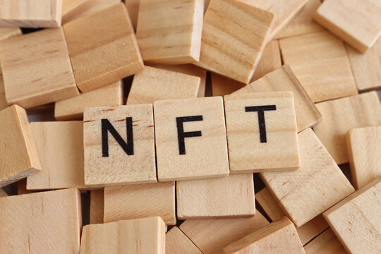Wooden cubes with the text NFT – non fungible token