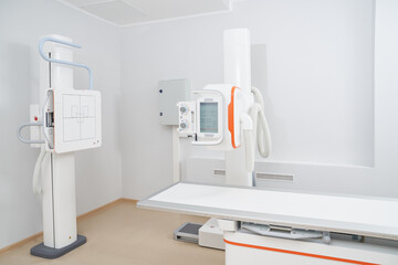 Modern cabinet of radiology and ultrasound tools in clinic with white walls and interior. Empty area for diagnostic after work day. Concept of professional tools treating and check of health.