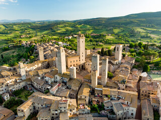 Fototapeta Aerial view of famous medieval San Gimignano hill town with its skyline of medieval towers, including the stone Torre Grossa. UNESCO World Heritage Site. obraz