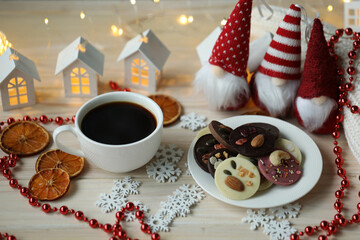cup of coffee and christmas cookies on the table