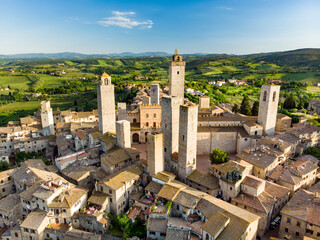 Obraz premium Aerial view of famous medieval San Gimignano hill town with its skyline of medieval towers, including the stone Torre Grossa. UNESCO World Heritage Site.